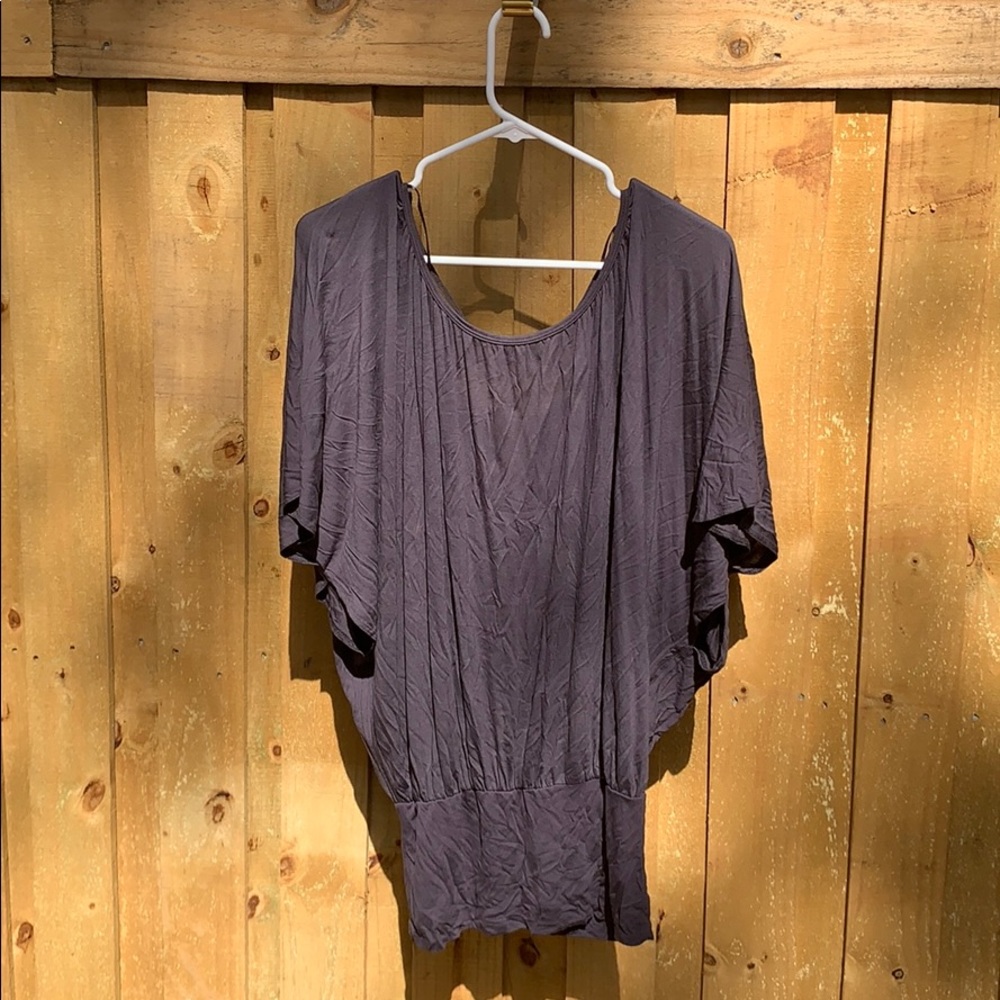 Super cute shirt with fitted bottom, open back